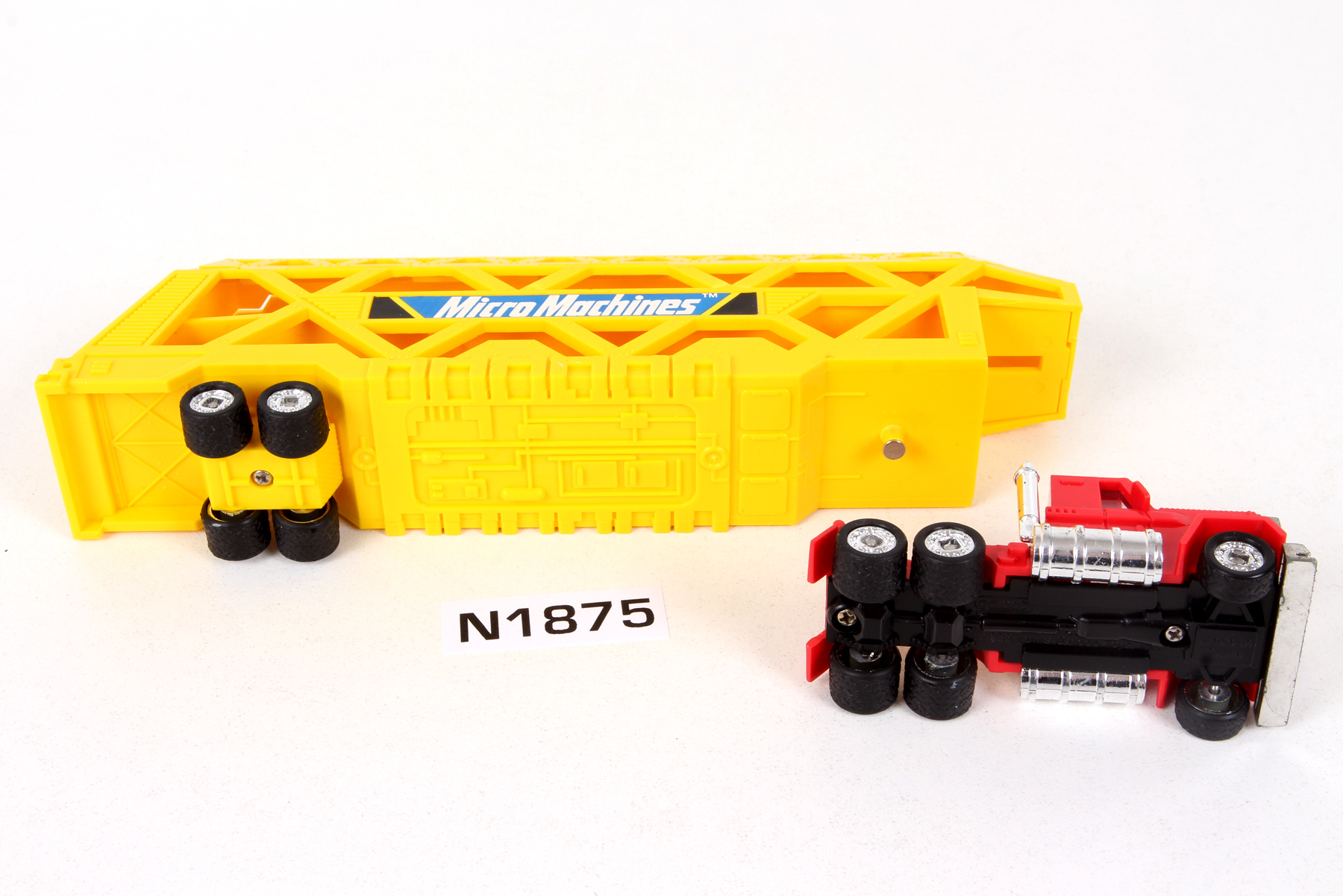 Complete Micro Machines® Vehicles Big Rig Hauler (red and yellow